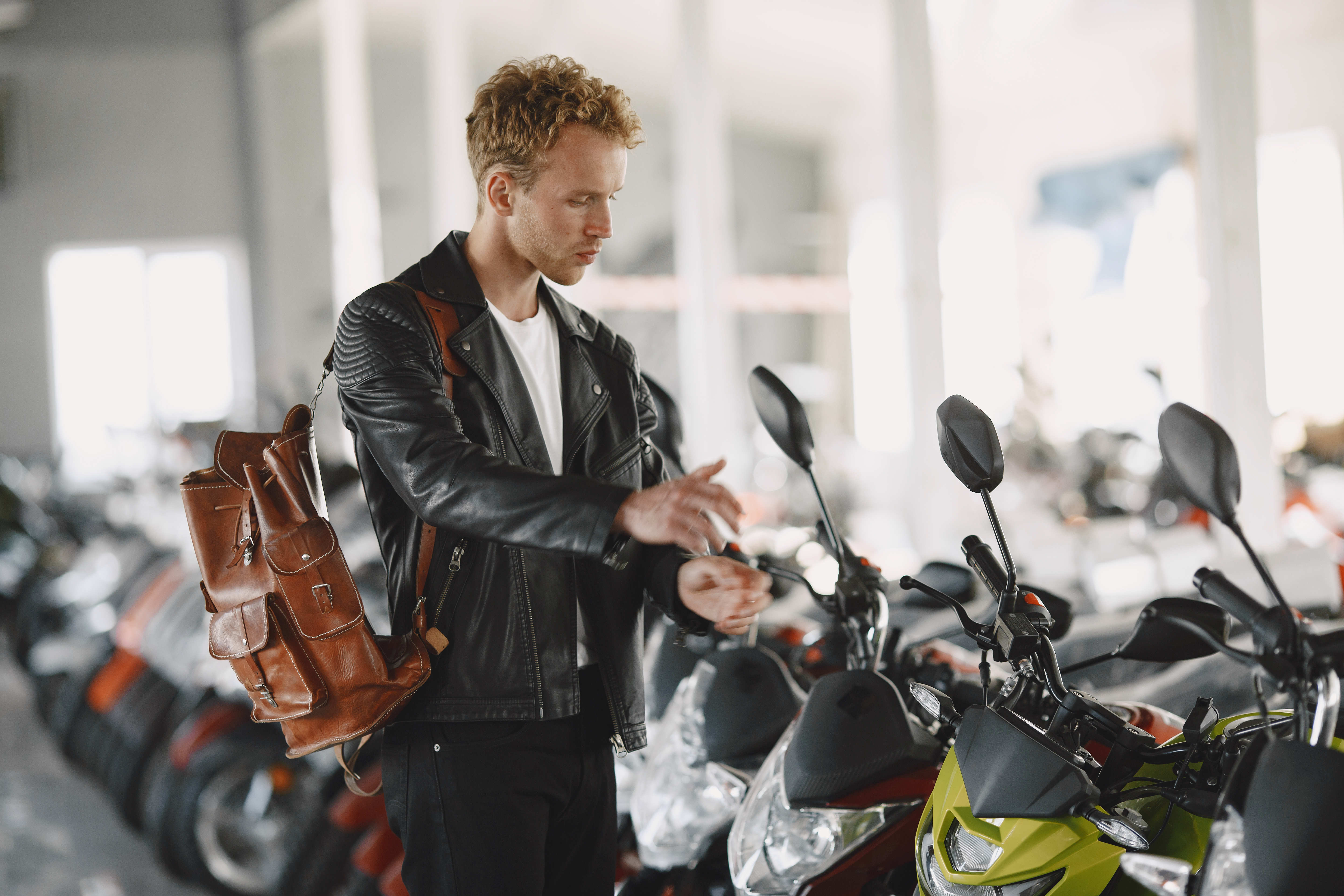 man-choose-check-buying-motorcycle