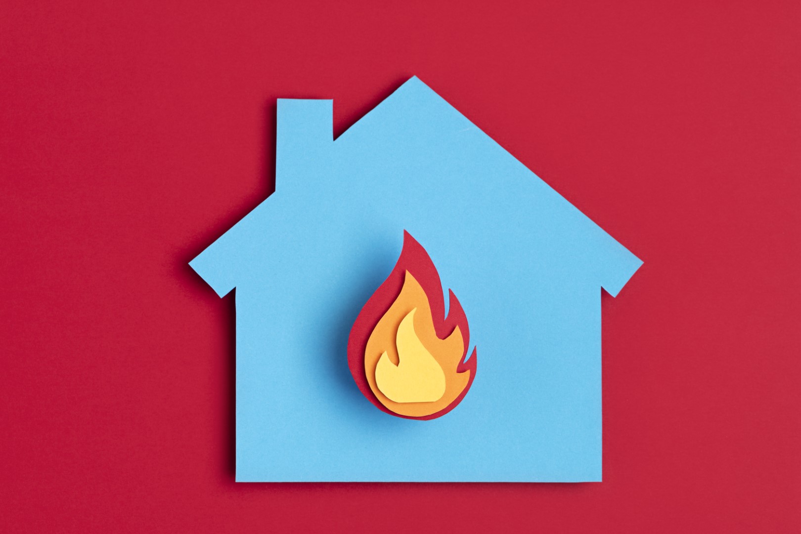 papercut-house-with-fire-inside-home-insurance-fire-prevention