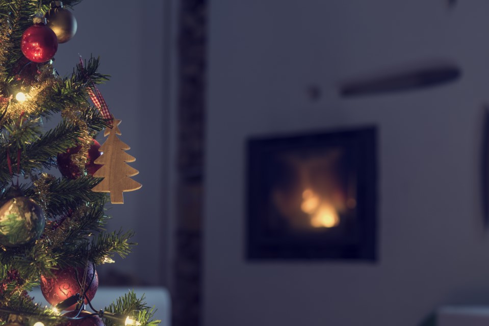 decorated-christmas-tree-near-a-burning-fire-holiday-fire-safety-tips